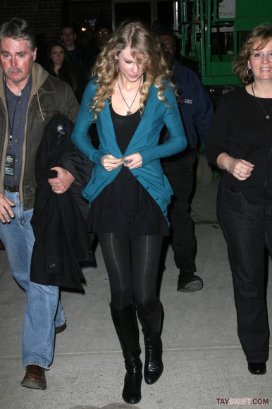 Taylor Swift in a blue cardigan