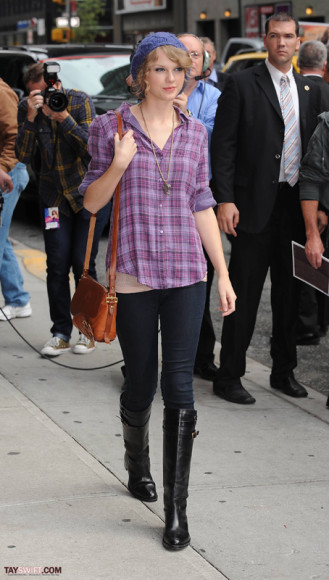 Taylor Swift in a plaid shirt and jeans