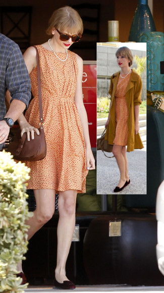 Orange patterned dress with pearls and a mustard yellow coat